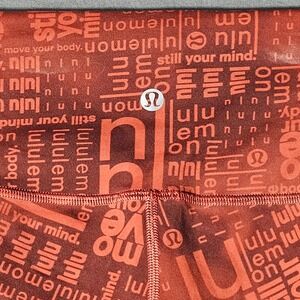 Lululemon Womens High Rise Leggings Rust Orange Logo Script Print Size 8